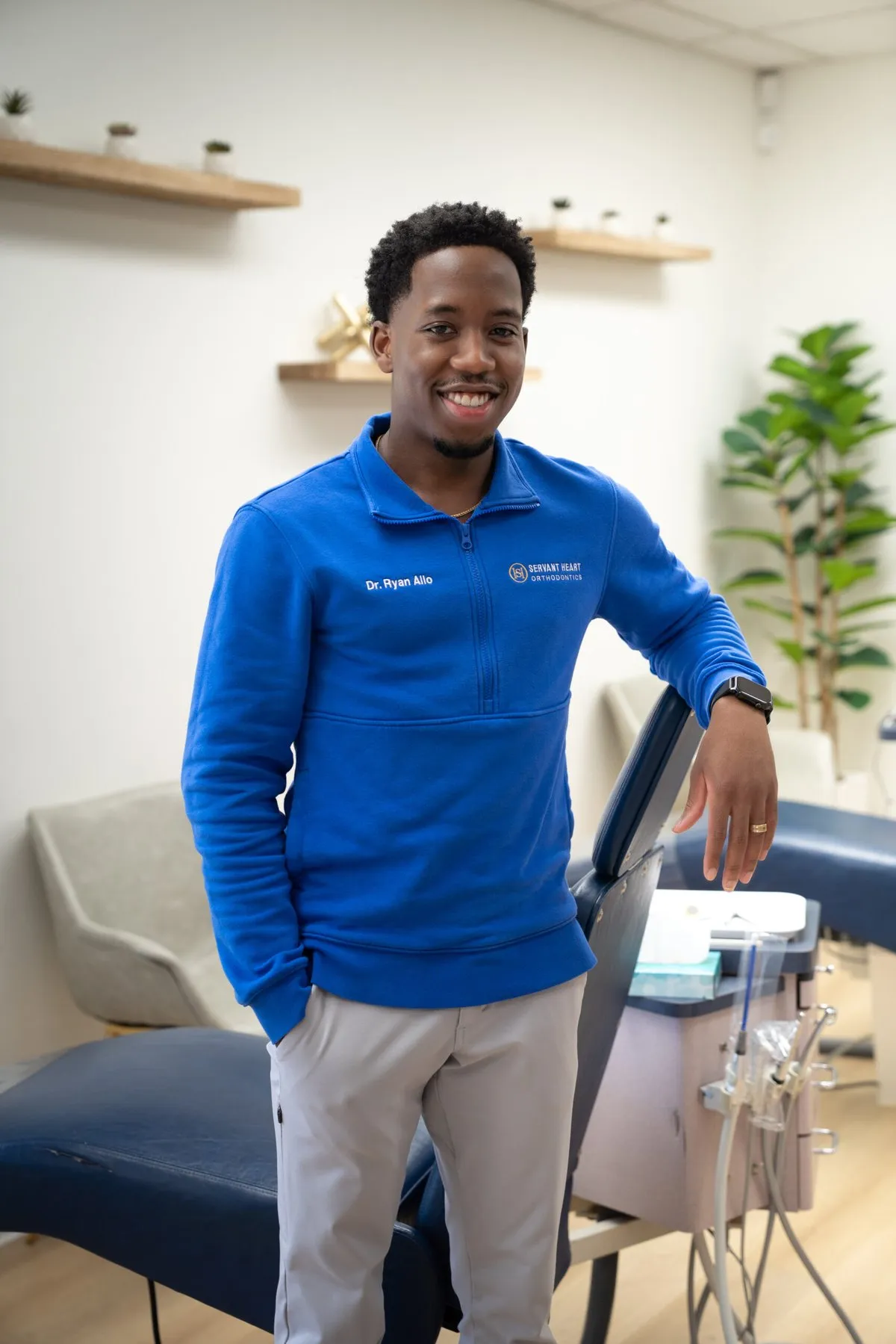 Dr. Ryan Allo standing in the treatment area of Servant Heart Orthodontics in Rowlett, TX